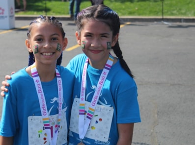 Girls on the Run participants smile after their 5K