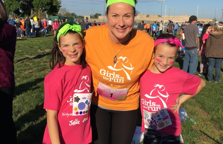GOTR Coach Renee Brown with her daugthers, then part of the program, after completing the end-of-season 5K.